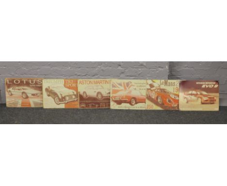 Six decorative enamel advertising signs for sports cars / motorsports including Lotus, Triumph Aston Martin.