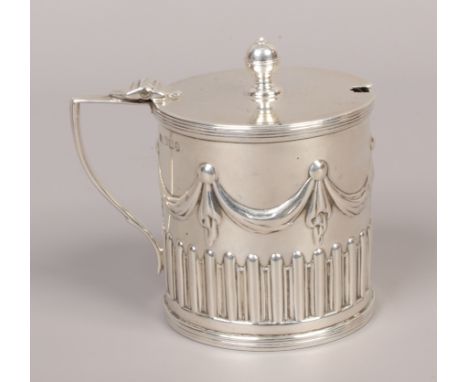 A Victorian silver mustard pot, assayed Sheffield 1894 by Harrison Brothers &amp; Howson with Bristol blue glass liner, silve