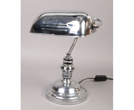 A chrome effect bankers lamp.