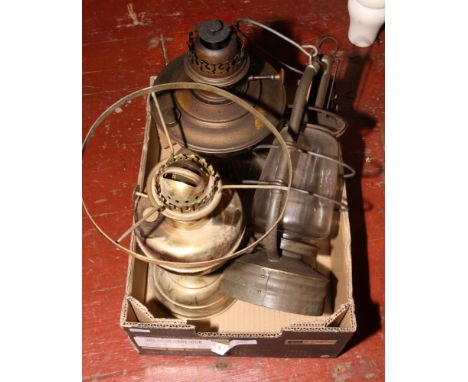 Two brass based oil lamps one Veritas with a Veritas Pax lantern.