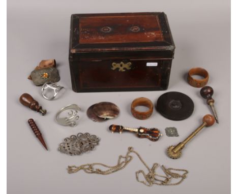 A distressed Georgian mahogany tea caddy and collectables including desk seal, buckles and serviette rings etc.