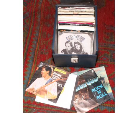 A carry case of rock single records to include The Rolling Stones, Pink Flloyd, Rainbow etc.