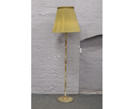 An onyx and gilt metal standard lamp.