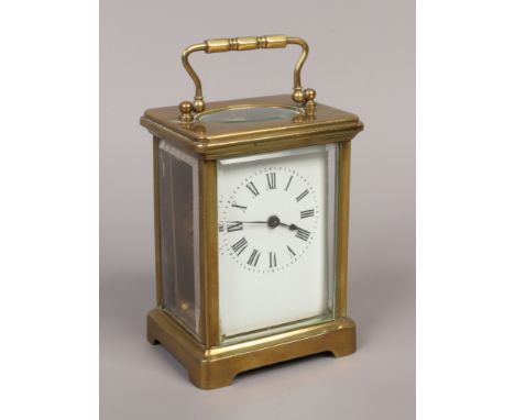 A brass cased carriage clock with platform escapement.Condition report intended as a guide only.Good condition. Running.