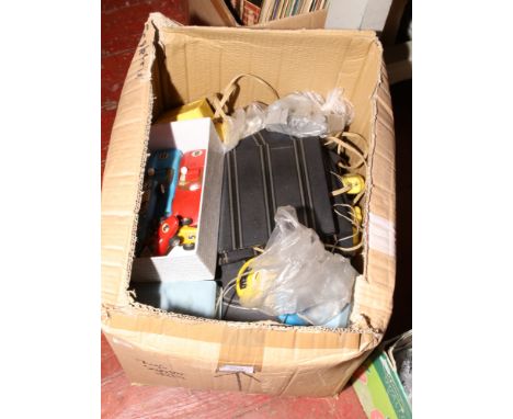 A box of vintage scalextric to include cars, tracks, transformers etc.