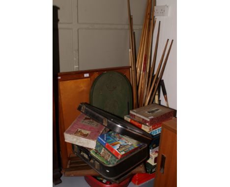 A large collection of games / accessories to include cues, dart board, bagatelle board, board games etc.