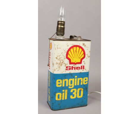 An advertising Shell engine oil can converted to a table lamp.