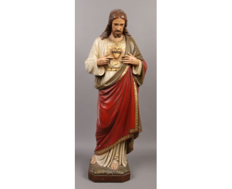 A vintage plaster cast statue Jesus Christ with sacred heart emblem approximately 100cm high.Condition report intended as a g