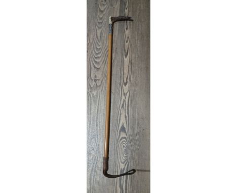 A Swaine &amp; Co antler handled and hallmarked silver mounted cane riding crop.