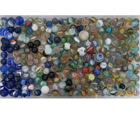 A box of assorted mainly glass marbles, various designs including latticino, corkscrew etc, various sizes.