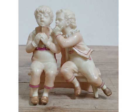 A Royal Worcester blush ivory figure group by James Hadley, Goldsmith's Boys sat on bench with gilt verse 'The Busy Whisperâ€