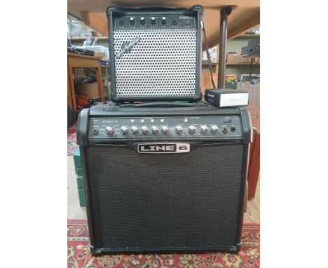 A Line 6 Spider IV 3D guitar amplifier and a Geasr4Music S15A.