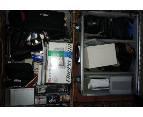A case and a box of assorted camera accessories including digital compact cameras etc.