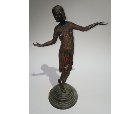 A modern Art Deco style cast metal figure in the manner of Chiparus, height 53cm.Condition - original finish lost due to fire
