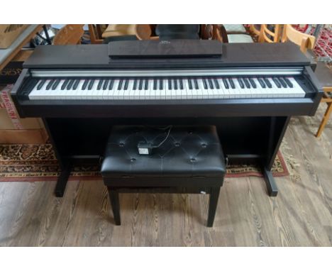 A Yamaha Arius YDP-141  electric piano and stool.