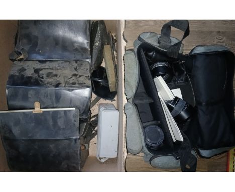 A box of cameras and accessories including three Polaroid Land cameras and three Sigma lenses.