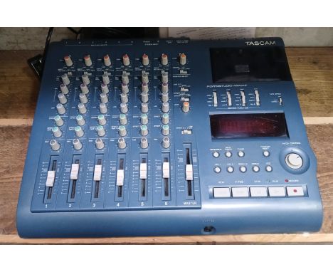 A Tascam Portastudio 424 MKIII 4-track cassette recorder/mixer.