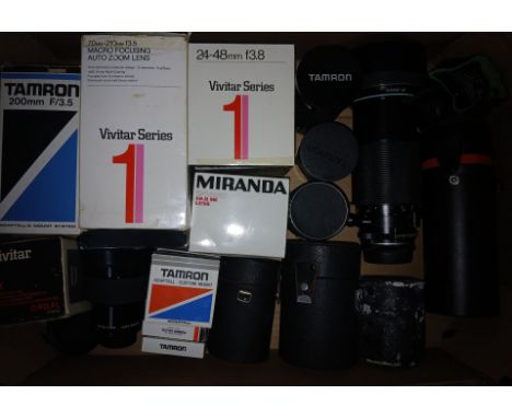 A box of assorted camera lens including Vivitar, Miranda, Tamron etc.