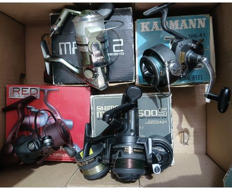 A group of four boxed fishing reels comprising Drennan Red Range float fish reel, Shimano Match 2500S, Karmann No.41 and Shak