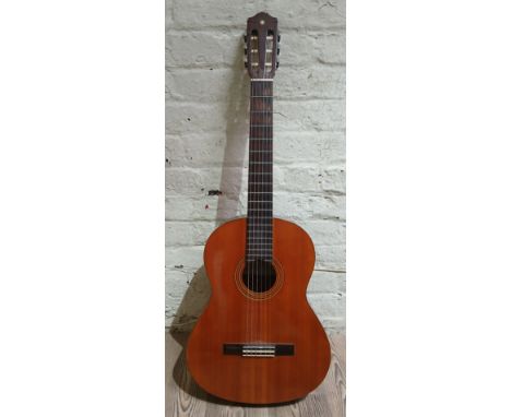 A Yamaha CG-110 nylon strung classical acoustic guitar.