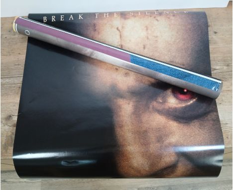 A tube of film posters including Hannibal, Disney etc.