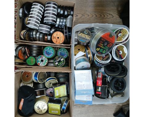 Four boxes of mainly unused fishing line, various weights.