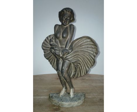 A cast iron door stop modelled as Marilyn Monroe, height 34cm.