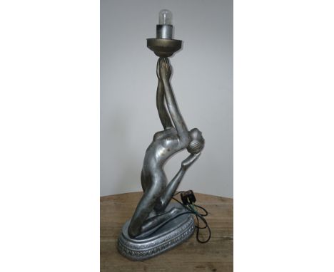 A modern composite Art Deco style figural lamp modelled as a female nude arching back and hold up light, height 67cm.Conditio