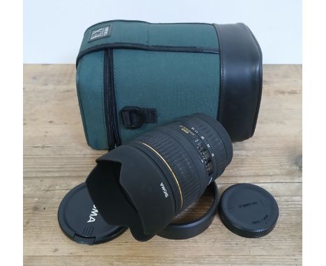 A Sigma DG 150-500mm 1:5-6.3 APO HSM zoom lens with soft case.Condition:- Light general wear, appears to be small web like pa