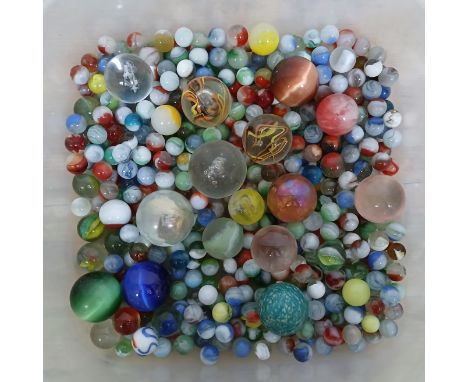 A quantity of mainly glass marbles, various designs.