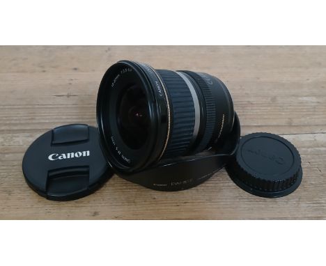 A Canon zoom lens EF-S 10-22mm 1:3.5-4.5Condition:- Light general wear, appears to be no matter under both glass  ends, no no