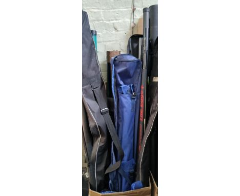 A box of assorted fishing rods and tackles, poles etc.Note:- not all tubes have rods or poles in them.