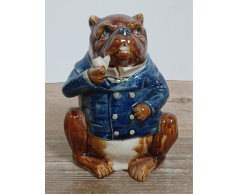 A Victorian earthen ware tobacco jar modelled as a bulldog smoking a pipe, height 18cm. Condition - hairline to base of pipe 