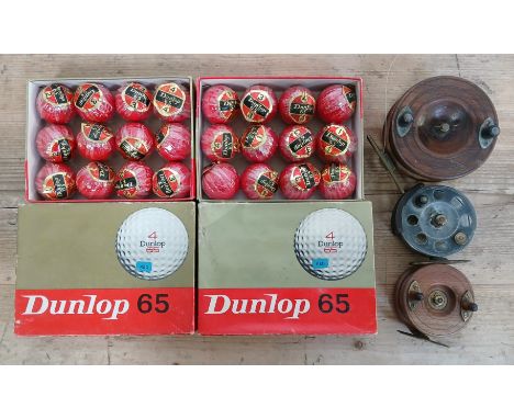 Three fishing reels including a Wilkes Osprey salmon reel and two boxes of Dunlop 65 unused vintage golf balls.