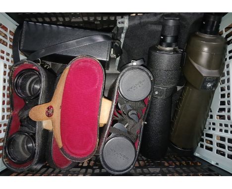 A box including two spotting scopes; Nikon and Bushnell Spacemaster and three pairs of binoculars including two pairs of Pent