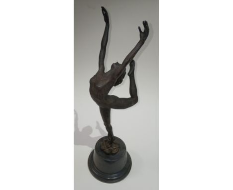 A modern Art Deco style bronze modelled as a girl dancing on top of two coiled snakes, circular marble base, height 55cm.Cond