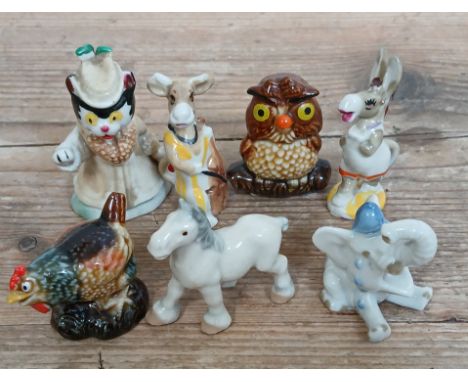 A group of seven Wade Whimsies rarities comprising Miss Fluffy cat, Clara the Cow playing cello, Madam chicken, Jumbo Jim cry