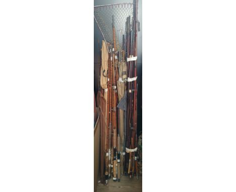 A large quantity of vintage fishing rods including split cane etc.