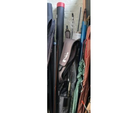 A box of assorted fishing rods and tackle.