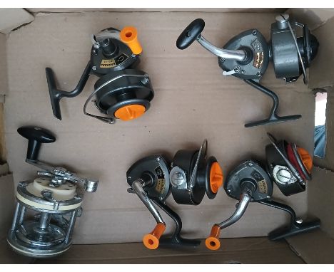 A group of four vintage Karmann No.41 fishing reels and a vintage French sea fishing reel.