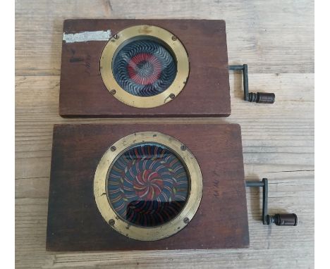 Two kaleidoscopic mechanical magic lantern slides.