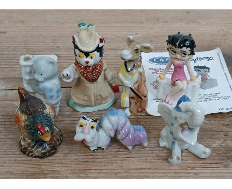 A group of seven Wade Whimsies rarities comprising Disney Merlin caterpillar, Betty Boop, cat playing the piano, Madam chicke