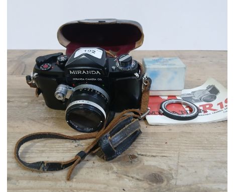 A Miranda DR 1.9 35mm SLR camera with booklet, waist level viewfinder and Pentax lens adapter.Condition:- General wear throug