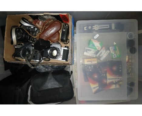 A large box of assorted cameras and accessories including four vintage cameras; Pentax, Fujica, Canon and Voigtlander.