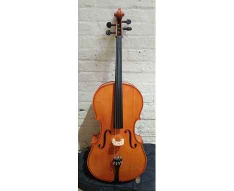 A Romanian Stentor full size student cello, labelled 'Made in the Workshops of Andreas Zeller...', with soft case.