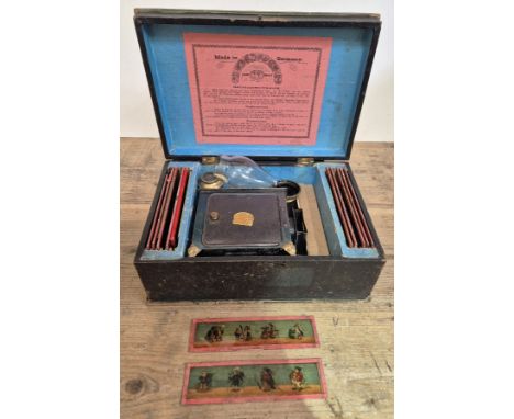 A German tin plate lantern, boxed with slides.