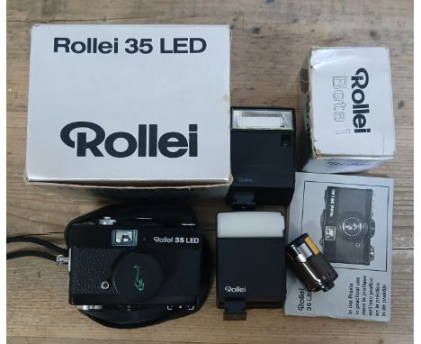 A Rollei 35 LED with accessories.Condition:- General wear throughout, no sign of any damage to body, some light corrosion to 