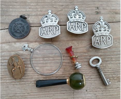 Assorted collectables including three hallmarked silver ARP badges, a Pixie Promise badge, a cheroot holder, agate seal etc.