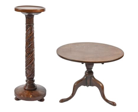 A Victorian mahogany tripod table, 54cm h, 69cm diam and a contemporary spiral turned and carved mahogany torchere, 97cm h (2