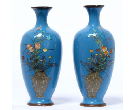A pair of Japanese cloisonne enamel oviform vases, early 20th c, in Kingfisher blue, decorated with a basket of flowers, 19cm